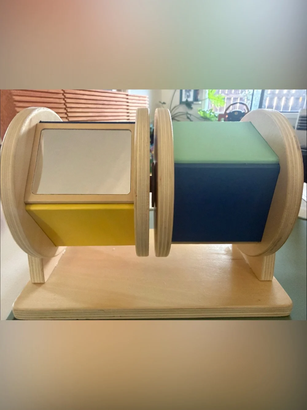 Wooden Rotating Shape Discovery Toy - Yellow, Blue, Green